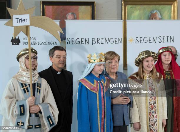German chancellor Angela Merkel of the Christian Democratic Union »and prelate Klaus Kraemer, the president of the Association of Holy Youth greet...