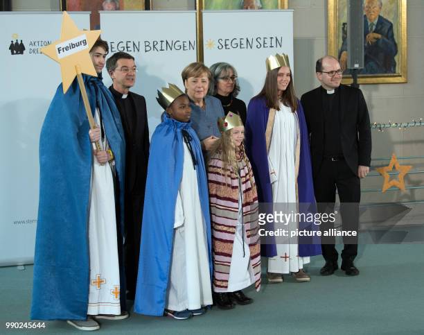 German chancellor Angela Merkel of the Christian Democratic Union, Father Dirk Bingener, the president of the German Catholic Youth and prelate Klaus...