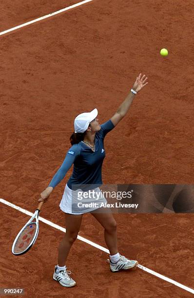 Martina Hingis of Switzerland serves in her second round match against Catalina Castano of Columbia during the French Open Tennis at Roland Garros,...