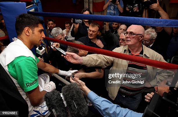 Amir Khan talks to the media during a training sessionat The Trinity Boxing Club NYC ahead of his WBA title fight against Paulie Malignaggi at...