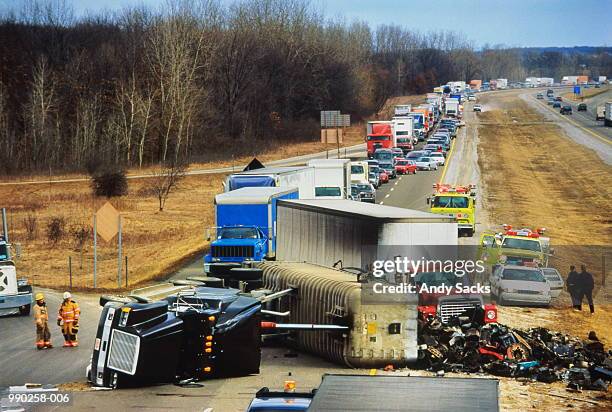 truck overturned on highway, traffic jam behind - truck and car accident stock pictures, royalty-free photos & images