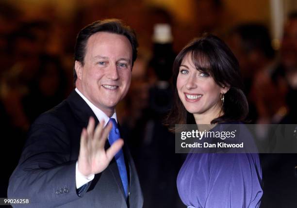 Prime Minister David Cameron and wife Samantha Cameron stand on the steps of Downing Street on May 11, 2010 in London, England. After five days of...