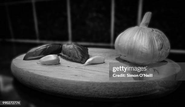 basil & garlic - simon o stock pictures, royalty-free photos & images