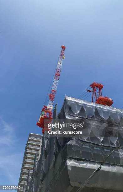 crane in construction site - kumacore stock pictures, royalty-free photos & images