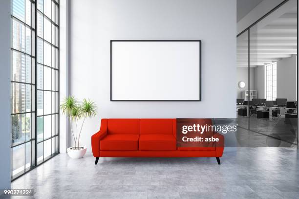 waiting room with empty frame and red sofa - poster template stock pictures, royalty-free photos & images