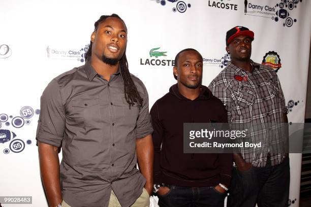 Minnesota Vikings football player Fred Evans, Chicago Bears football player Garrett Wolfe and Kansas City Chiefs football player Corey Mays poses for...