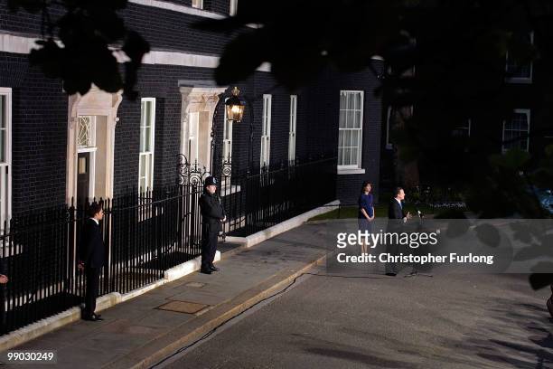 Conservative leader David Cameron speaks to the media as he becomes the British Prime Minister, as his his wife Samantha looks on, in Downing St on...