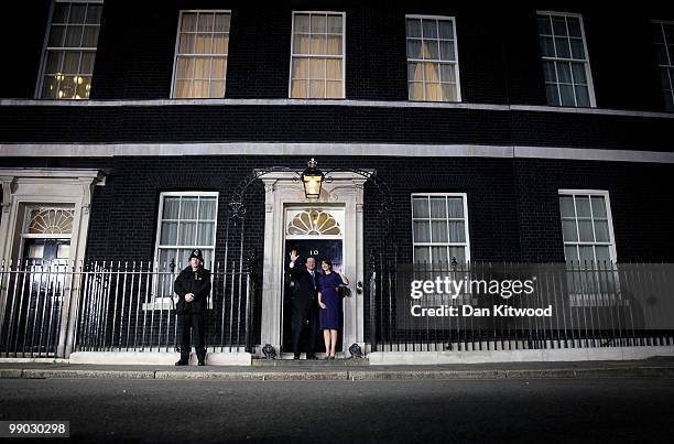 Prime Minister David Cameron and wife Samantha Cameron wave on the steps of Downing Street on May 11, 2010 in London, England. After five days of...