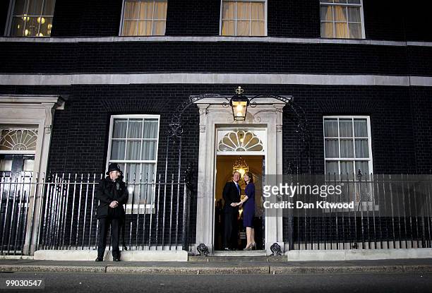 Prime Minister David Cameron and wife Samantha Cameron stand on the steps of Downing Street on May 11, 2010 in London, England. After five days of...