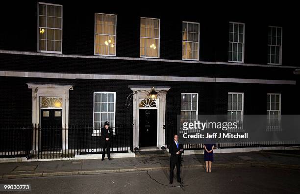Prime Minister David Cameron stands on the steps of 10 Downing Street with his wife Samantha on May 11, 2010 in London, England. After five days of...