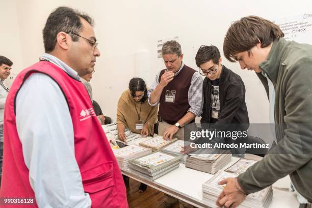 Polling station officials prepare the voting tickets during the 2018 Presidential Elections at polling station Museo Casa Leon Trotsky on July 1,...