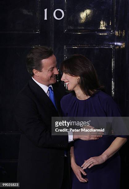 Prime Minister David Cameron hugs his wife Samantha on the steps of Number 10 Downing Street on May 11, 2010 in London, England. After five days of...