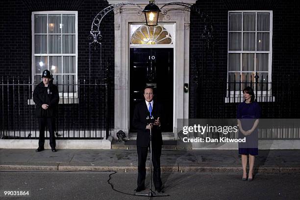 Prime Minister David Cameron and wife Samantha Cameron stand on the steps of Downing Street on May 11, 2010 in London, England. After five days of...