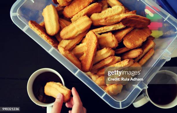 arabic way of eating biscuits - potato wedges stock pictures, royalty-free photos & images