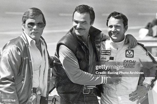 Burt Reynolds and Stan Barrett take a few photos before the Warner W. Hodgdon 400. Barrett would finish 11th and take home $2,100 for the race.