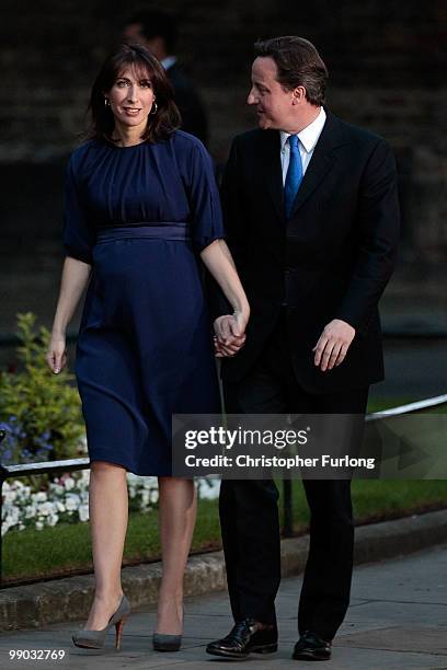 Conservative leader David Cameron and his wife Samantha arrive in Downing St as he becomes the new British Prime Minister on May 11, 2010 in London,...