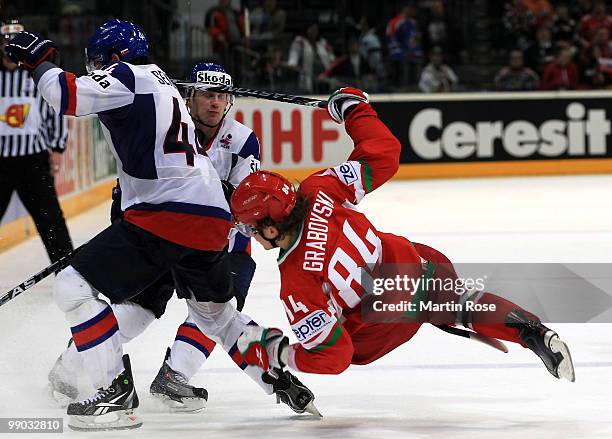 Mikhail Grabovski of Belarus clashes with Andrej Sekera of Slovakia during the IIHF World Championship group A match between Belarus and Slovakia at...