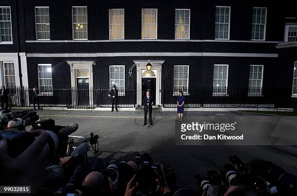 Conservative leader David Cameron speaks to the media as he becomes the British Prime Minister, as his wife Samantha looks on, on May 11, 2010 in...
