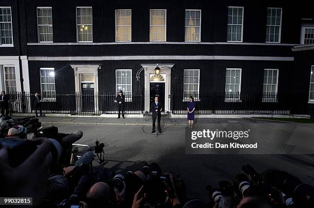 Conservative leader David Cameron speaks to the media as he becomes the British Prime Minister, as his wife Samantha looks on, on May 11, 2010 in...