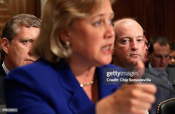 America Chairman and President Lamar McKay and BP America Executive Vice President David Nagel listen to Sen. Mary Landrieu deliver opening remarks...