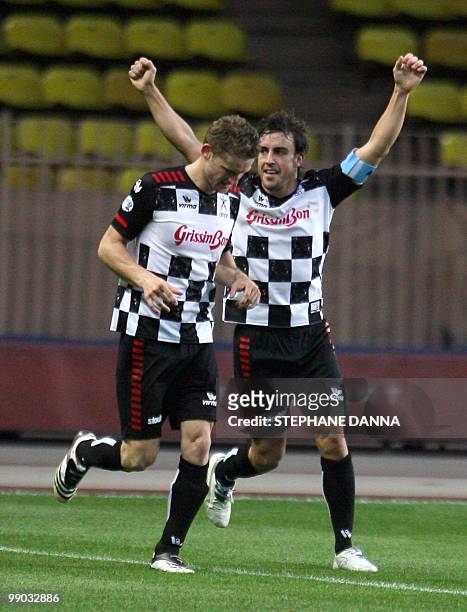 Spanish driver Fernando Alonso reacts after scoring during a charity football match between Prince Albert's Star Team and the F1 "Nazionale Piloti"...
