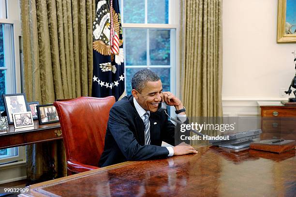 President Barack Obama calls to congratulate new British Prime Minister David Cameron in the Oval Office of the White House May 11, 2010 in...