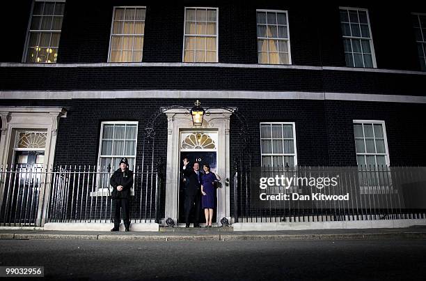 Prime Minister David Cameron and wife Samantha Cameron wave on the steps of Downing Street on May 11, 2010 in London, England. After five days of...