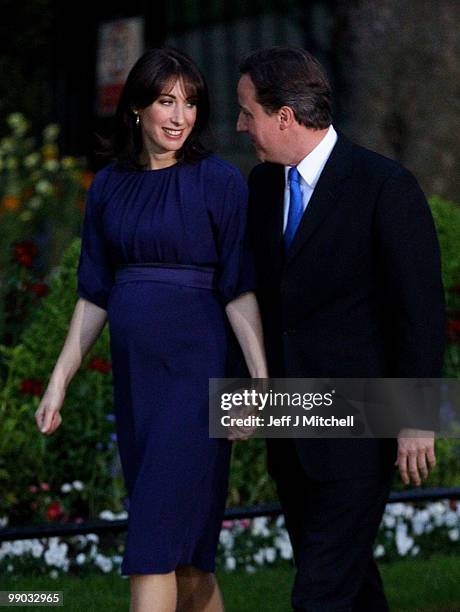 Conservative leader David Cameron and his wife Samantha arrive in Downing St as he becomes the new British Prime Minister on May 11, 2010 in London,...