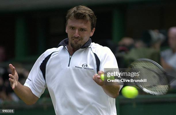 Goran Ivanisevic of Croatia on his way to victory over Marat Safin of Russia during the men's quarter finals of The All England Lawn Tennis...