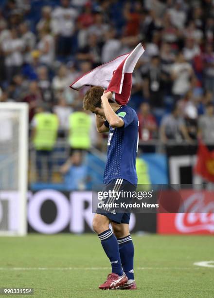 Yuya Osako of Japan looks dejected after a 3-2 loss to Belgium in the World Cup round of 16 in Rostov-On-Don, Russia, on July 2, 2018. ==Kyodo