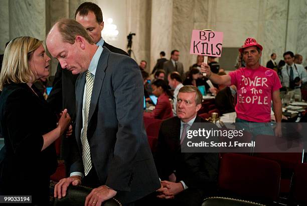 May 11: Lamar McKay, president and chairman of BP America Inc., talks with aide Liz Reicherts of BP during a break in the Senate Energy and Natural...