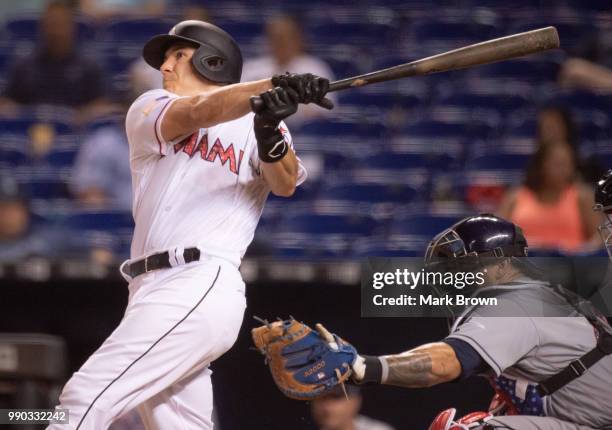 Realmuto of the Miami Marlins singles in the tenth inning against the Tampa Bay Rays at Marlins Park on July 2, 2018 in Miami, Florida.