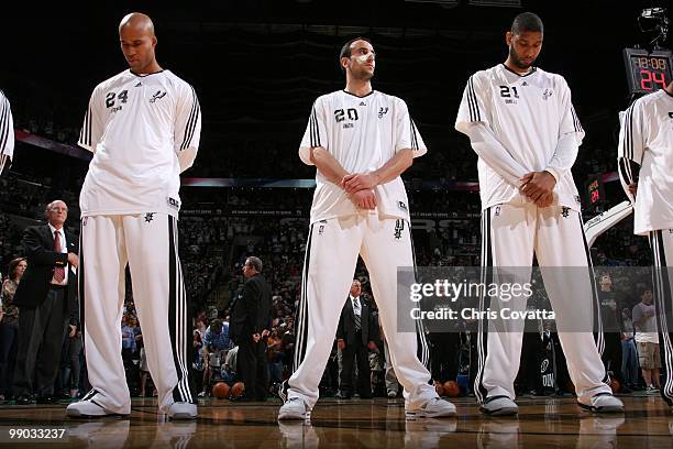 Richard Jefferson, Manu Ginobili and Tim Duncan of the San Antonio Spurs stand for the singing of the national anthem in Game Six of the Western...