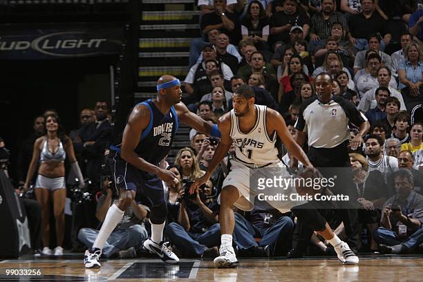 Tim Duncan of the San Antonio Spurs drives against Erick Damplier of the Dallas Mavericks in Game Six of the Western Conference Quarterfinals during...