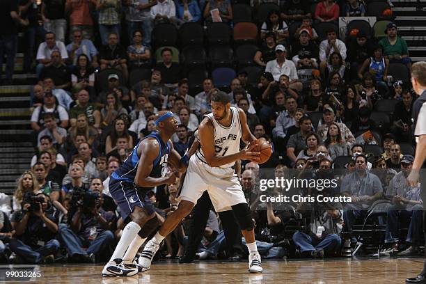 Tim Duncan of the San Antonio Spurs is defended by Jason Terry of the Dallas Mavericks in Game Six of the Western Conference Quarterfinals during the...