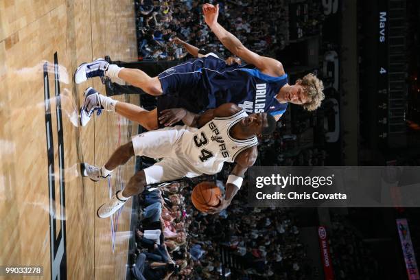 Antonio McDyess of the San Antonio Spurs drives against Dirk Nowitzki of the Dallas Mavericks in Game Six of the Western Conference Quarterfinals...