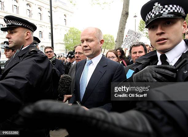 William Hague , the Conservatives Shadow Foreign Secretary, is escorted to Portcullis House by police following talks with a team of senior figures...