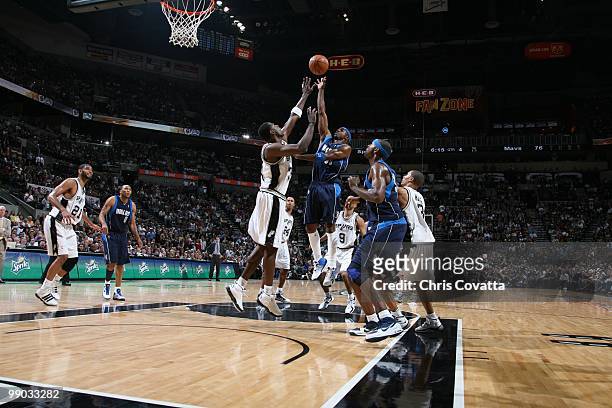 Jason Terry of the Dallas Mavericks jumps up for the ball against Antonio McDyess of the San Antonio Spurs in Game Six of the Western Conference...