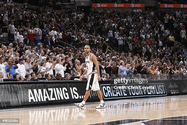 Tony Parker of the San Antonio Spurs walks off the court against the Dallas Mavericks in Game Six of the Western Conference Quarterfinals during the...