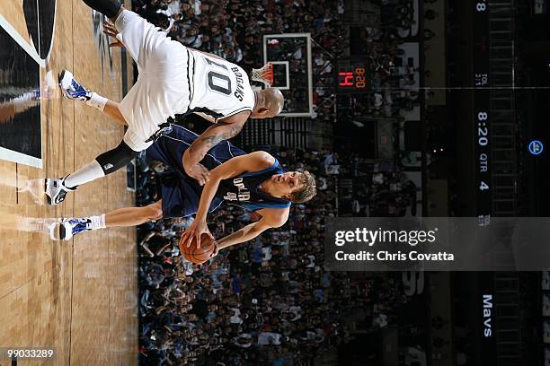 Dirk Nowitzki of the Dallas Mavericks looks to move around Keith Bogans of the San Antonio Spurs in Game Six of the Western Conference Quarterfinals...