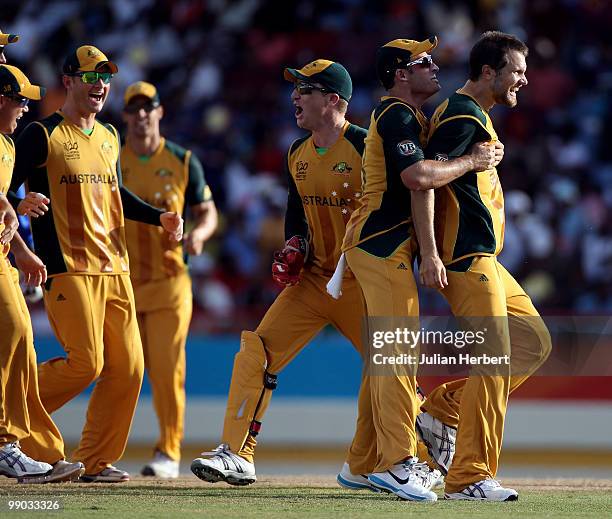 Mike Hussey of Australia congratultes Dirk Nannes after he took the wicket of Chris Gayle during the ICC World Twenty20 Super Eight match between the...