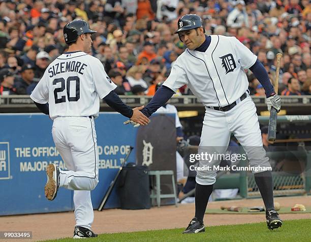 Scott Sizemore and Johnny Damon of the Detroit Tigers shake hands against the New York Yankees during the game at Comerica Park on May 10, 2010 in...