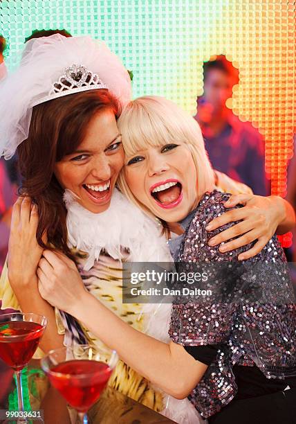 two young women at a hen night, smiling - addio al nubilato foto e immagini stock