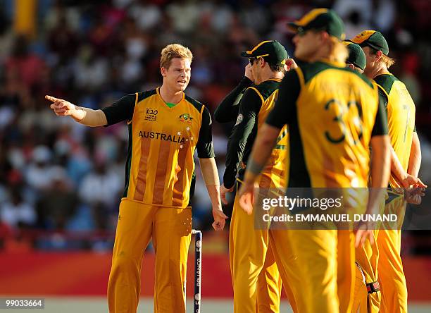 Australian bowler Steven Smith ant teammates await a third umpire ruling during the ICC World Twenty20 Super Eight match between West Indies and...