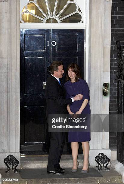 David Cameron, the new U.K. Prime minister, and his wife Samantha stand outside 10 Downing Street as they greet the media in London, U.K., on...