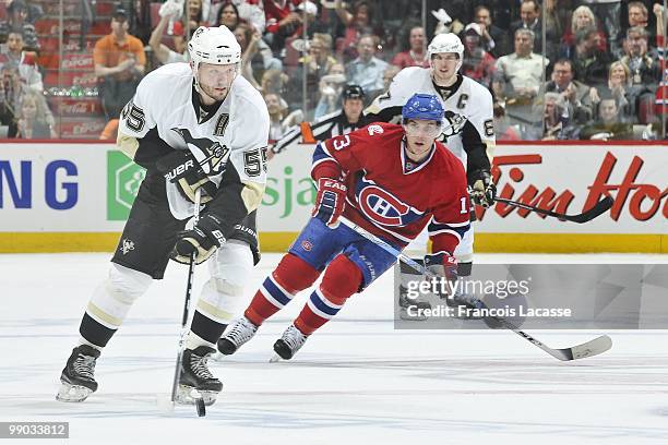 Sergei Gonchar of the Pittsburgh Penguins makes a pass in front of Mike Cammalleri of Montreal Canadiens in Game Four of the Eastern Conference...