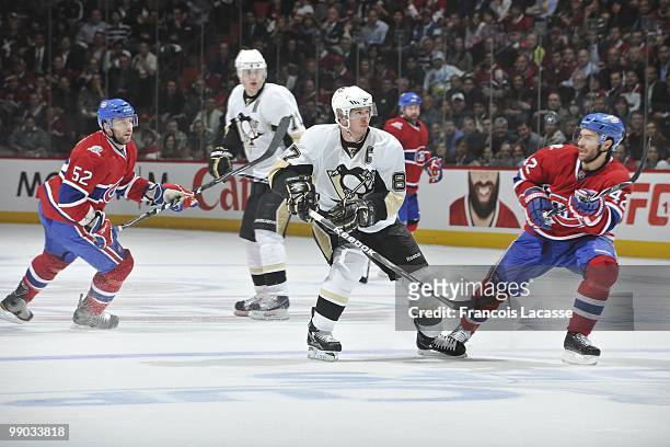 Sidney Crosby of the Pittsburgh Penguins waits for a pass in front of Mathieu Darche of the Montreal Canadiens in Game Four of the Eastern Conference...