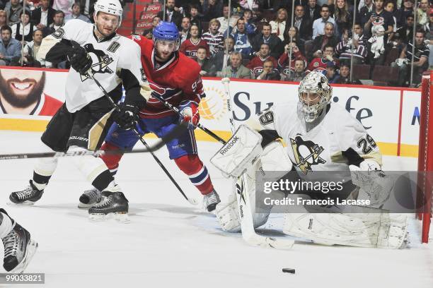 Marc-Andre Fleury of the Pittsburgh Penguins blocks a shot in front of Tom Pyatt of Montreal Canadiens in Game Four of the Eastern Conference...