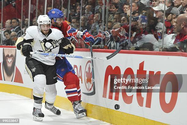 Alex Goligoski of the Pittsburgh Penguins collides with Maxim Lapierre of Montreal Canadiens in Game Four of the Eastern Conference Semifinals during...