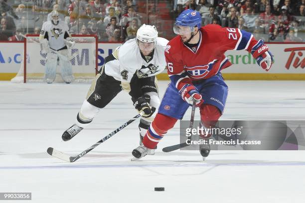 Josh Gorges of Montreal Canadiens skates with the puck in front of Chris Kunitz of the Pittsburgh Penguins in Game Four of the Eastern Conference...